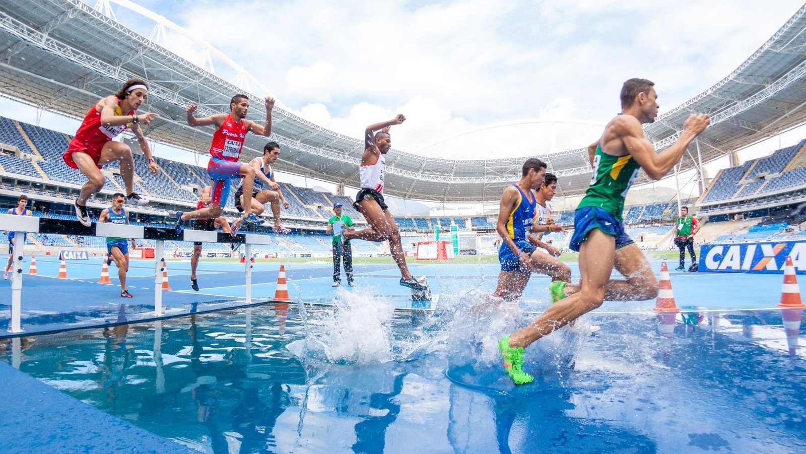 Some athletes running during an olympic game event.