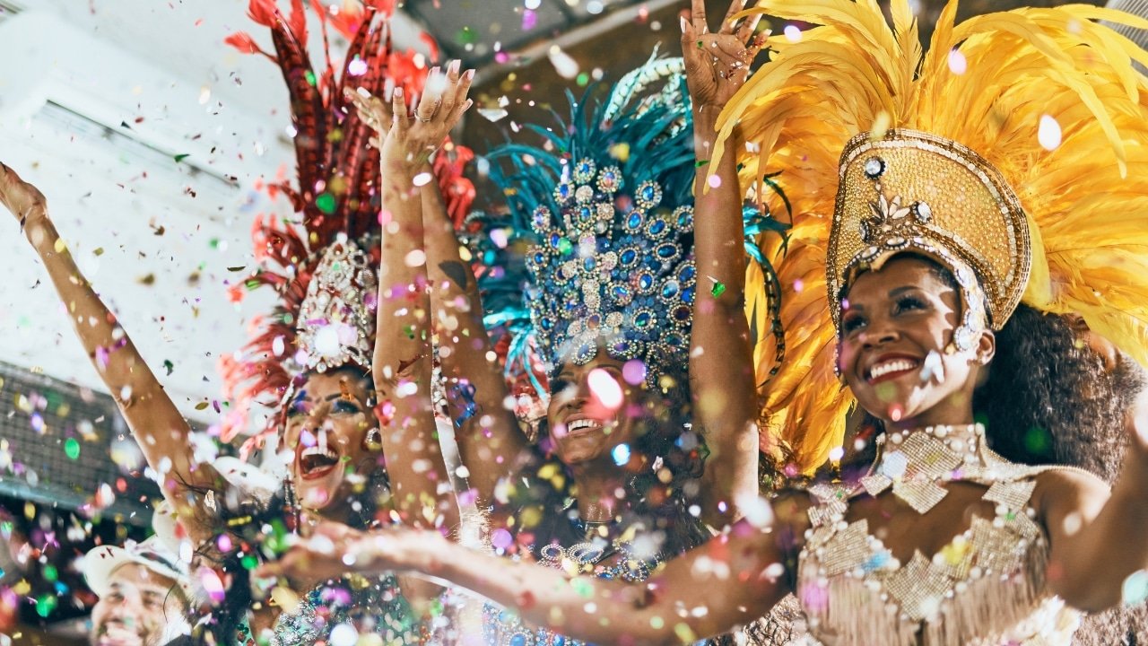 Energetic parade floats and joyful dancers at Carnaval in Rio de Janeiro, guided by their attentive luxury concierge