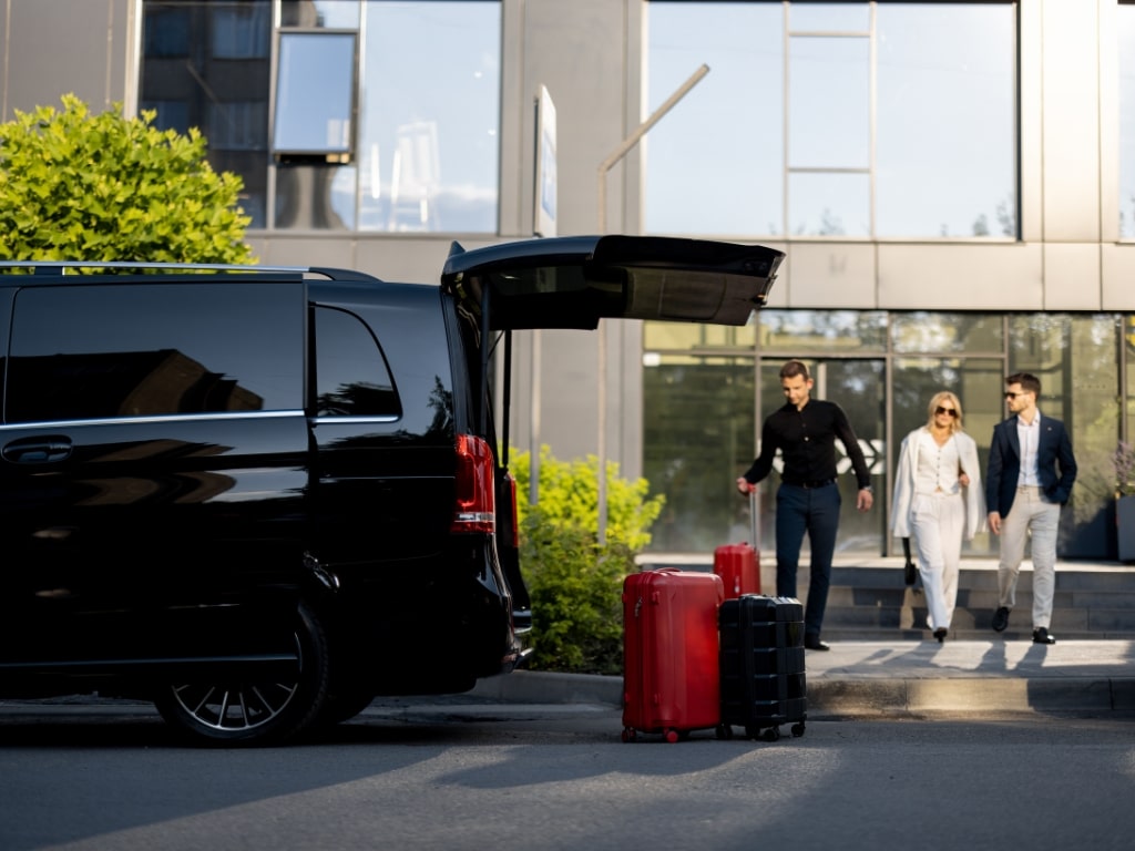 Clients arriving to their hotel after using a van rental service with chauffeur in Rio de Janeiro, Brazil.