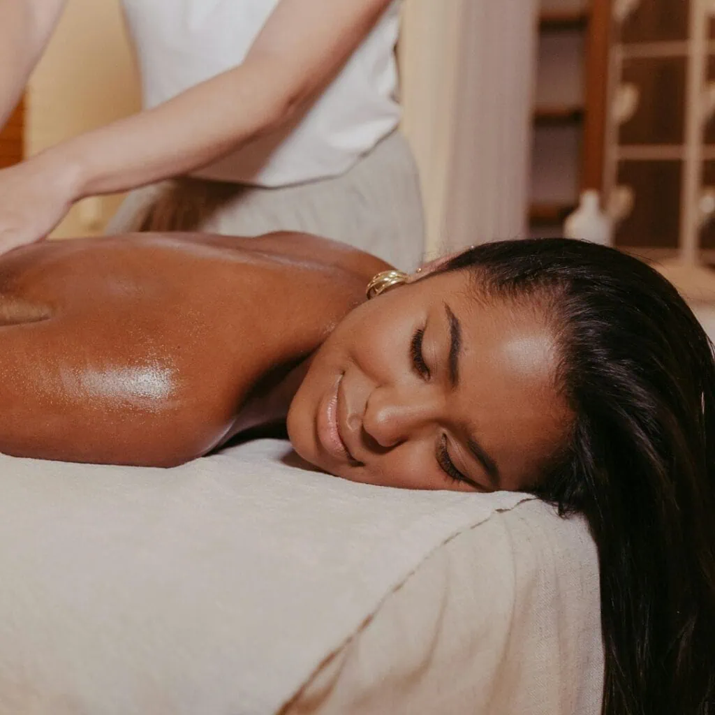 Home massage female and male in Rio de Janeiro a client getting a massage at home, in her apartment in Rio de Janeiro.