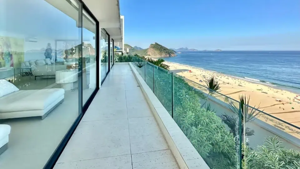 Balcony of a luxury apartment in Copacabana Beach with ocean view, luxury apartment rental Rio de Janeiro.