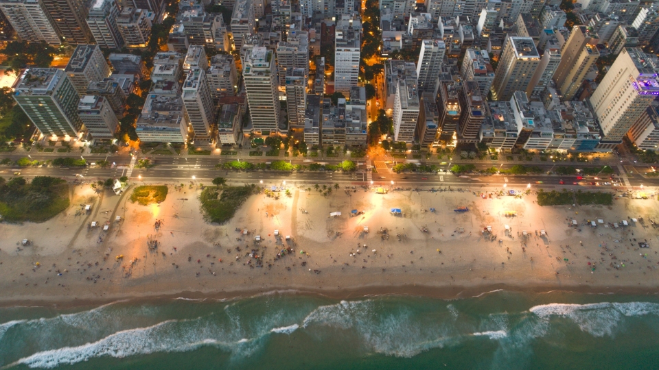 Why Choose Luxury Apartment Rental in Rio for Executives - Buildings erial shot above Ipanema Beach and beachfront buildings, luxury apartment rental Rio de Janeiro neighborhood.