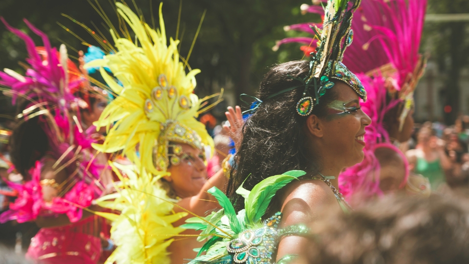 Crowds enjoying a colorful street bloco with vibrant costumes during Rio Carnival in Rio de Janeiro.