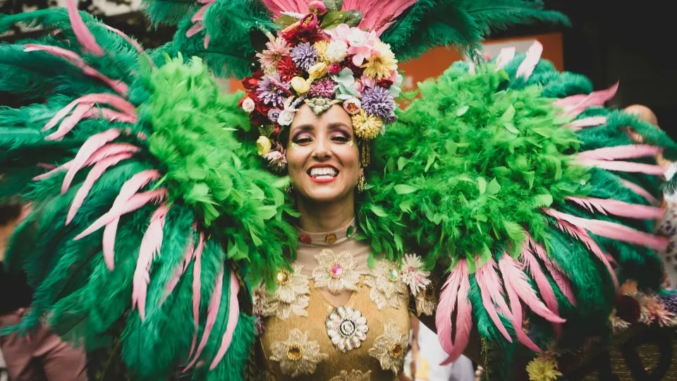 Carnival queen in an elaborate feathered costume leading the celebrations at Rio Carnival.
