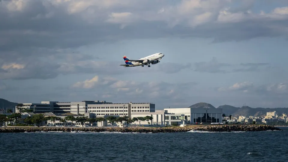 View of a plane taking off in a Rio de Janeiro airport, capturing the excitement of vip travel from Mexico and the start of a brazil adventure filled with luxury travel experiences.
