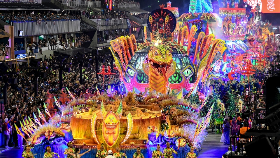 Carnival parade at the Sambadrome in Rio de Janeiro, with samba schools performing in coordinated costumes and large allegorical floats