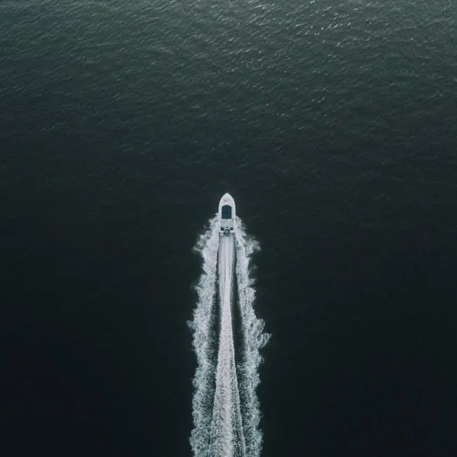 pexels-photo-570987-570987 A high-angle shot of a boat creating ripples as it speeds across the tranquil sea, highlighting a peaceful maritime adventure.