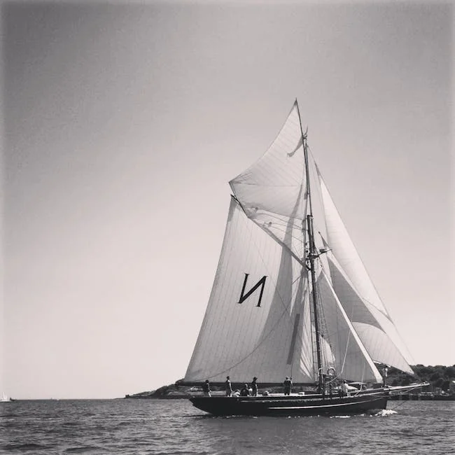 pexels-photo-73476-73476 Black and white photograph of a sailboat navigating the ocean near Cornwall, UK.