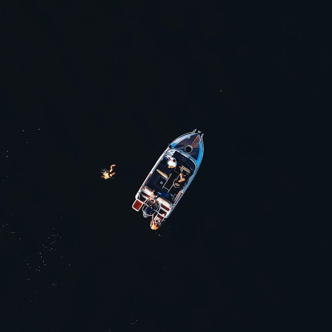 pexels-photo-9828410-9828410 Drone shot of a boat and swimmer in dark waters near Warszawa, Poland.