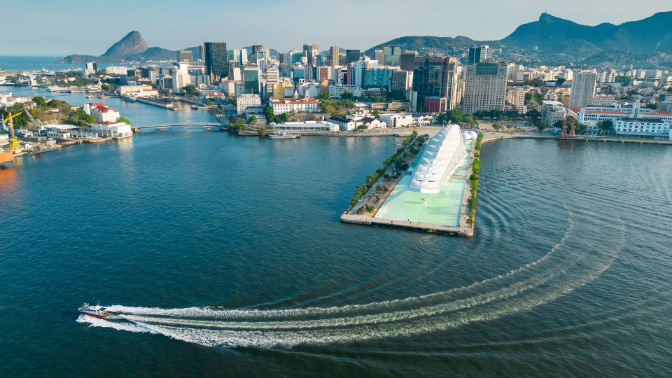 Private speed boat rental in Rio de Janeiro with Sugarloaf and Christ the Redeemer in the background, Brazil.