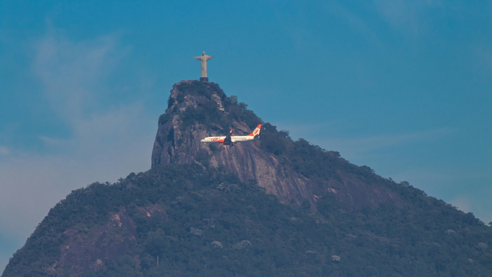 Plane in Rio de Janeiro Plane flying above Rio de Janeiro, city that will host IATA AGM in 2026